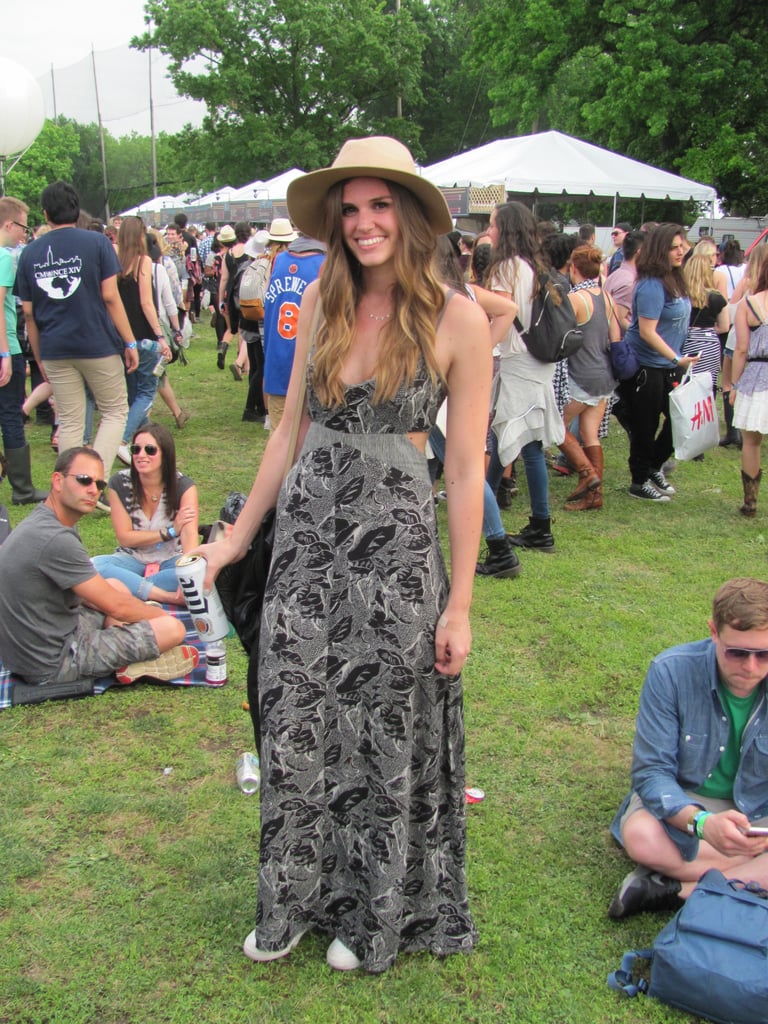 We loved the way this festivalgoer dressed down a cutout maxi dress with a cool hat and sneakers.