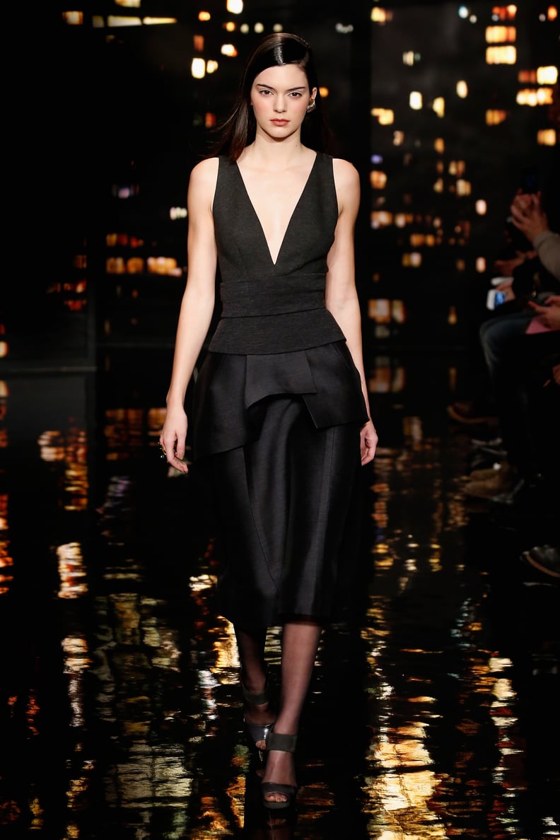 She Walked the Runway at Donna Karan in a Structured Black Dress With a Plunging Neckline