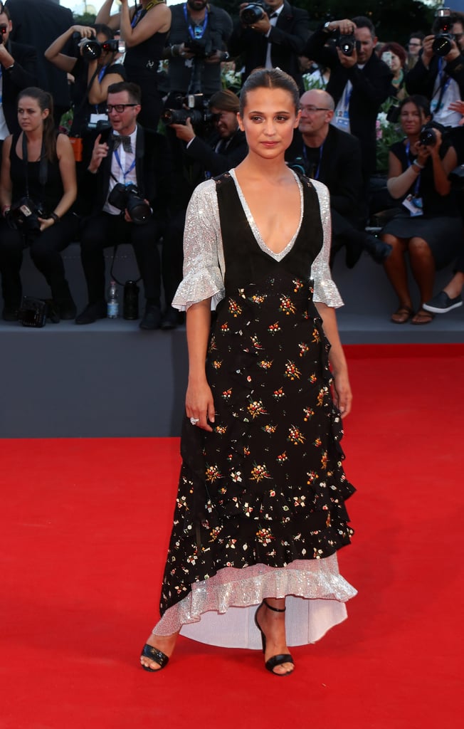 Alicia Vikander attended the premiere of The Lights Between Oceans at the Venice Film Festival wearing a floral and metallic dress.