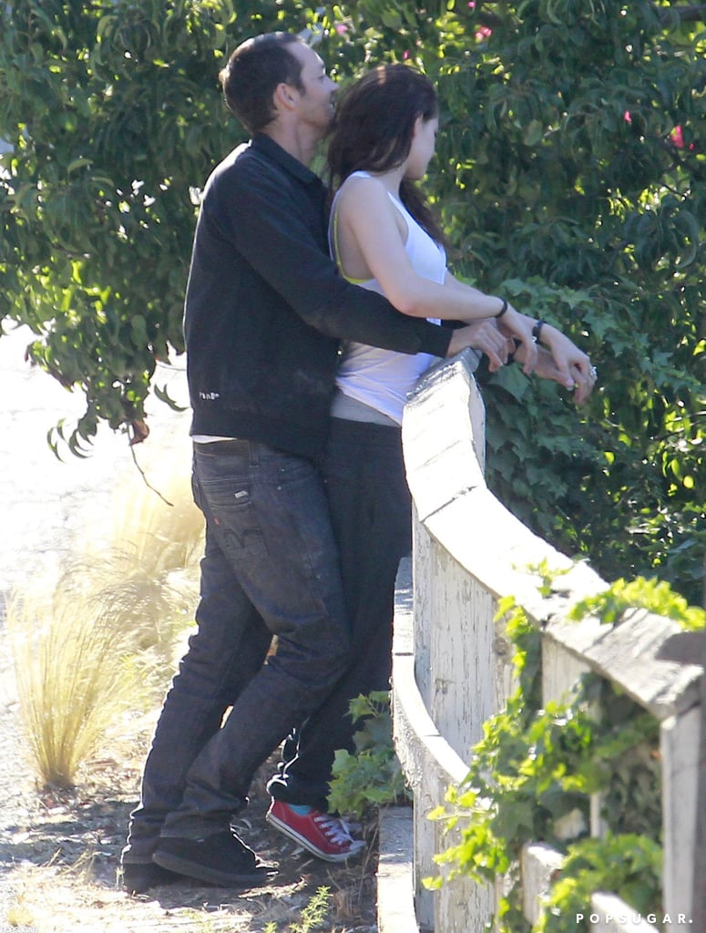 Rupert Sanders hugged Kristen Stewart from behind.