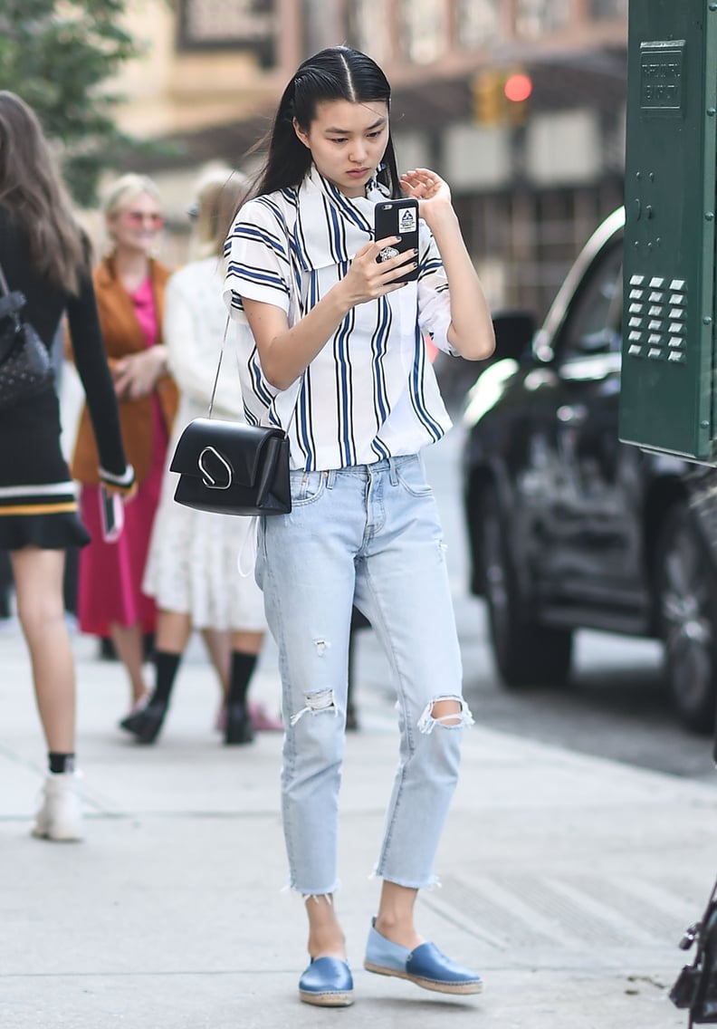 Style the Leather Paper Clip Flap Clutch With Light-Wash Jeans and a Striped Top