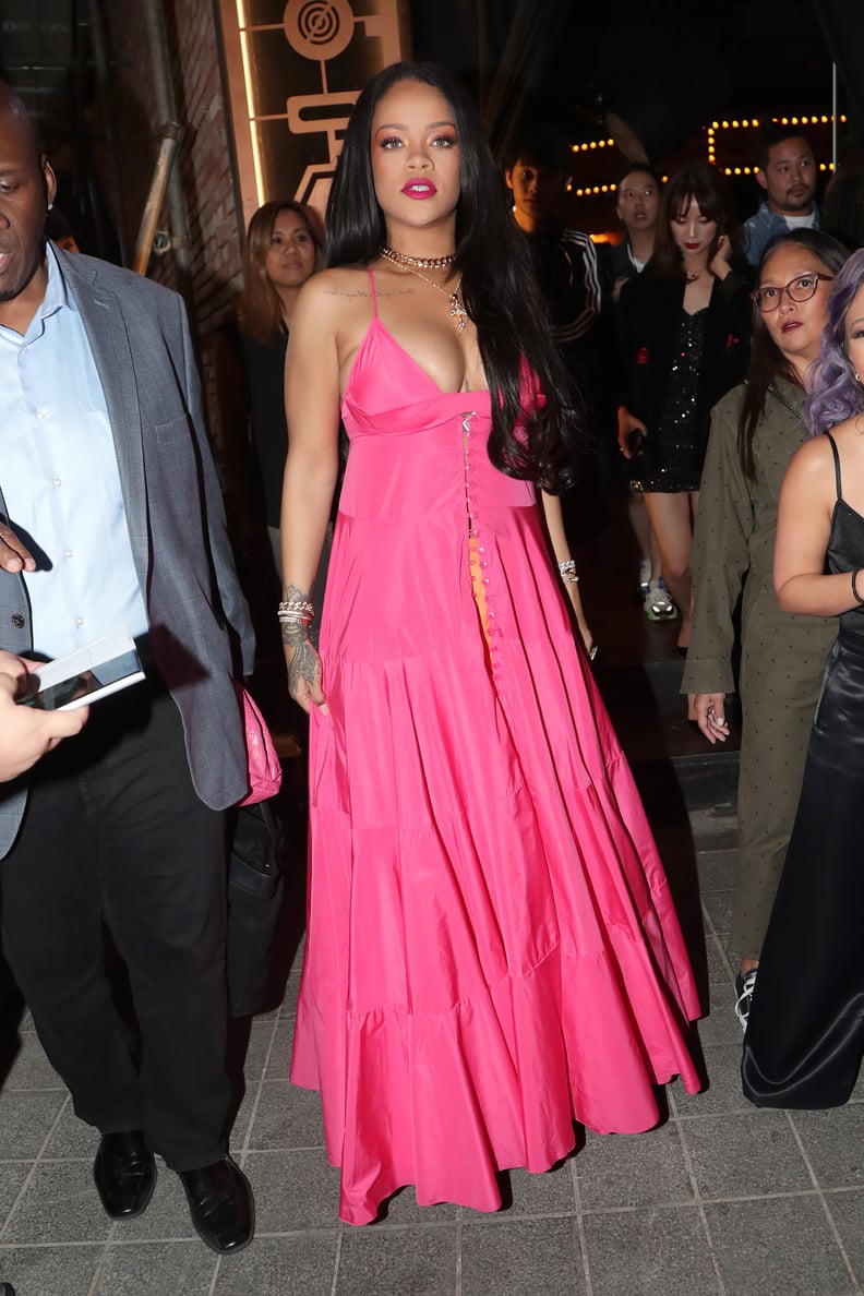 Rihanna Wearing a Pink Dress and Orange Pants in Seoul