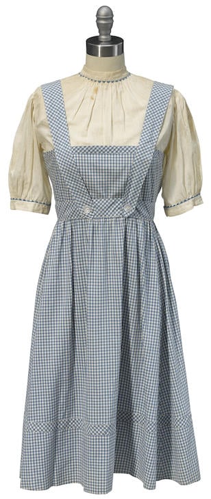 The current dress, which sold for $1.56 million, is still just as bright, but it has a slight stain at the neckline.