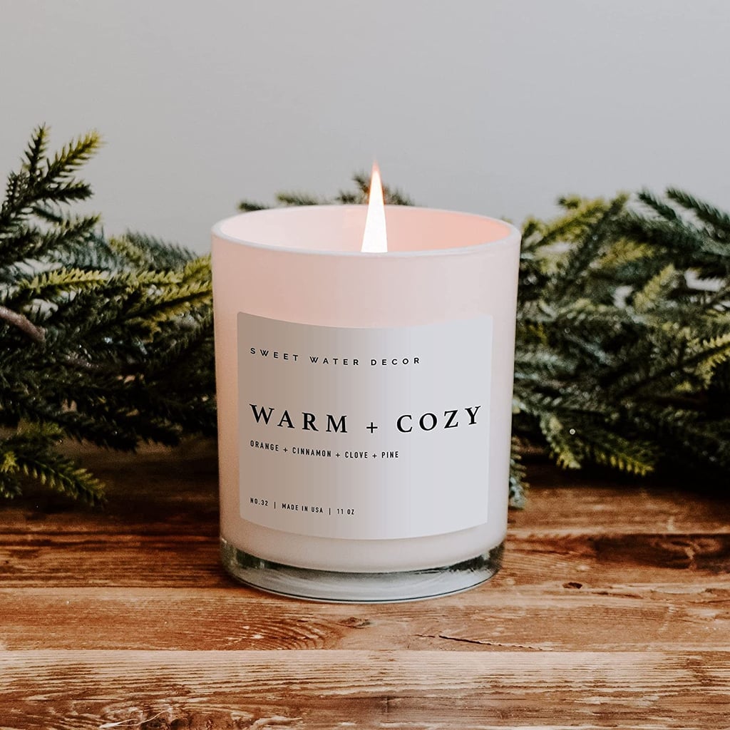 For a Festive Vibe: Sweet Water Decor Warm and Cozy Soy Candle</h2><div><div><p>                                                                    <img alt=