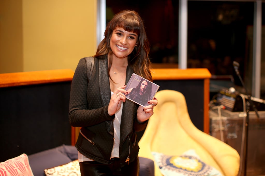 The singer held up her album cover.