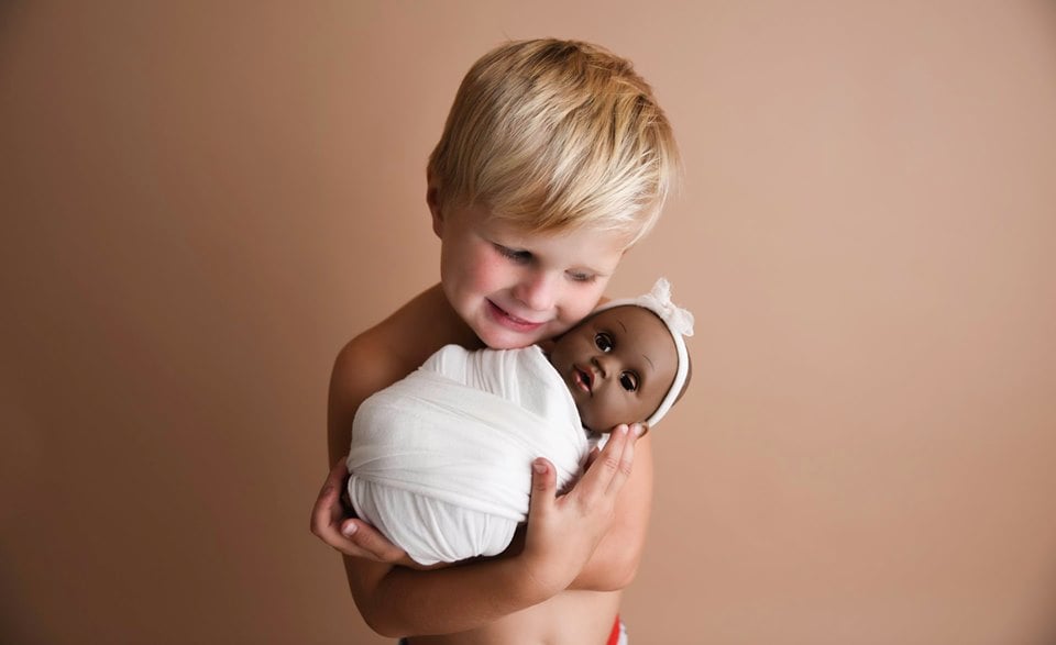 Photo Shoot of a Boy With His Doll