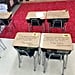 Teacher Writes Notes on Students' Desks Before Test