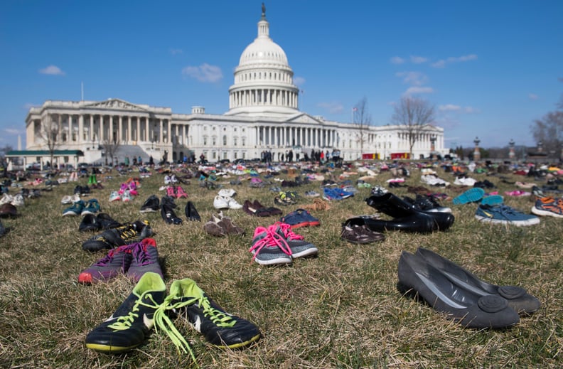 The lawn outside the US Capitol is covered with 7,000 pairs of empty shoes to memorialize the 7,000 children killed by gun violence since the Sandy Hook school shooting, in a display organized by the global advocacy group Avaaz, in Washington, DC, March 1