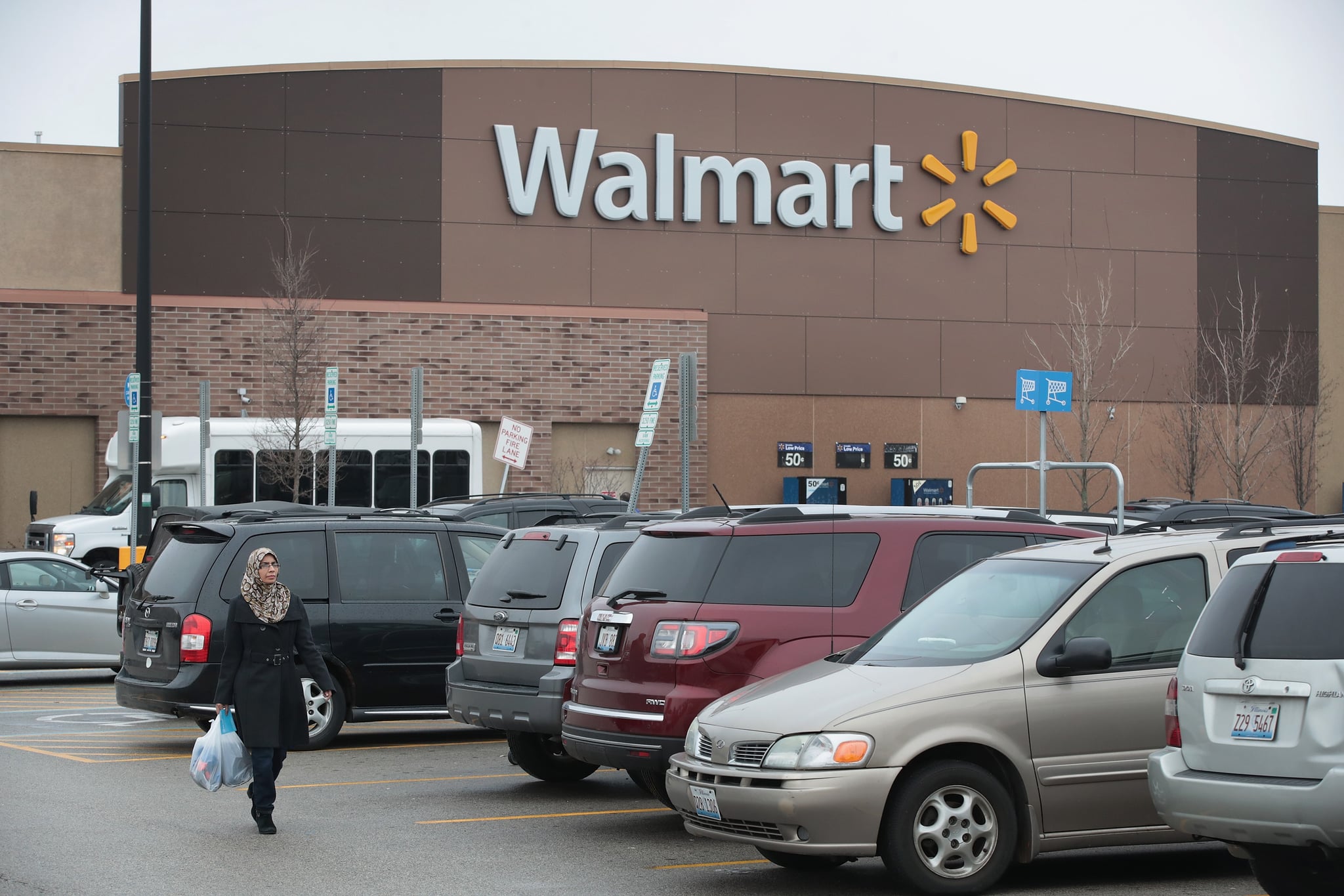 SKOKIE, IL - JANUARY 17:  Customers shop at a Walmart store on January 17, 2017 in Skokie, Illinois. Wal-Mart Stores Inc., the nation's largest employer, announced today that it plans to create approximately 10,000 retail jobs this year through the opening of 59 new, expanded and relocated Walmart and Sams Club facilities and e-commerce services.  (Photo by Scott Olson/Getty Images)