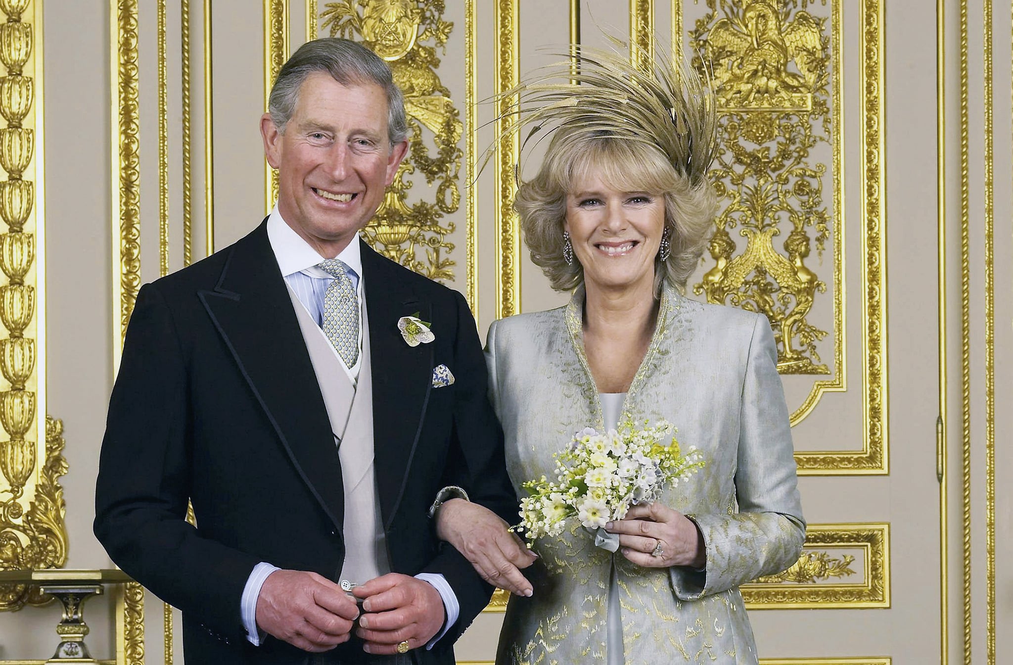 WINDSOR, ENGLAND - APRIL 9: Clarence House official handout photo of the Prince of Wales and his new bride Camilla, Duchess of Cornwall in the White Drawing Room at Windsor Castle after their wedding ceremony, April 9, 2005 in Windsor, England. (Photo by Hugo Burnand/Pool/Getty Images)