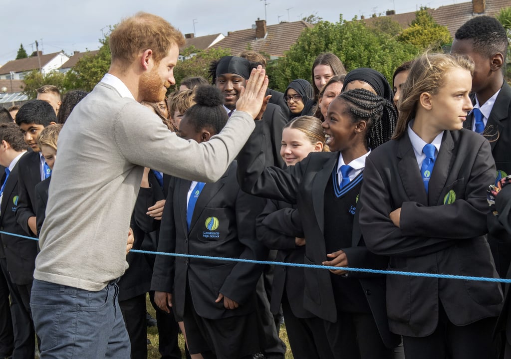 Prince Harry Hugs Kids at Lealands High School