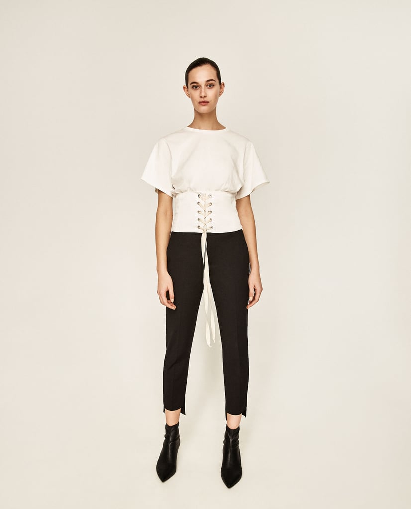 "Experimenting with the season's corset waists is easy when it comes in a wearable t-shirt like Zara's lace-up top ($30). It's about to elevate your everyday denim look." — HWM