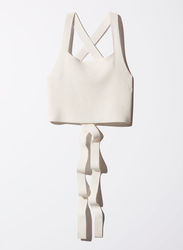 "Here's a top I will wear in May and beyond. Aritzia's cayenne knit piece ($75) is soft to the touch and stretchy too. My favorite part is the long straps, which you can tie a number of ways to give your outfits a new look every time. The crop style will pair well with my high-waisted gingham pants." — ML