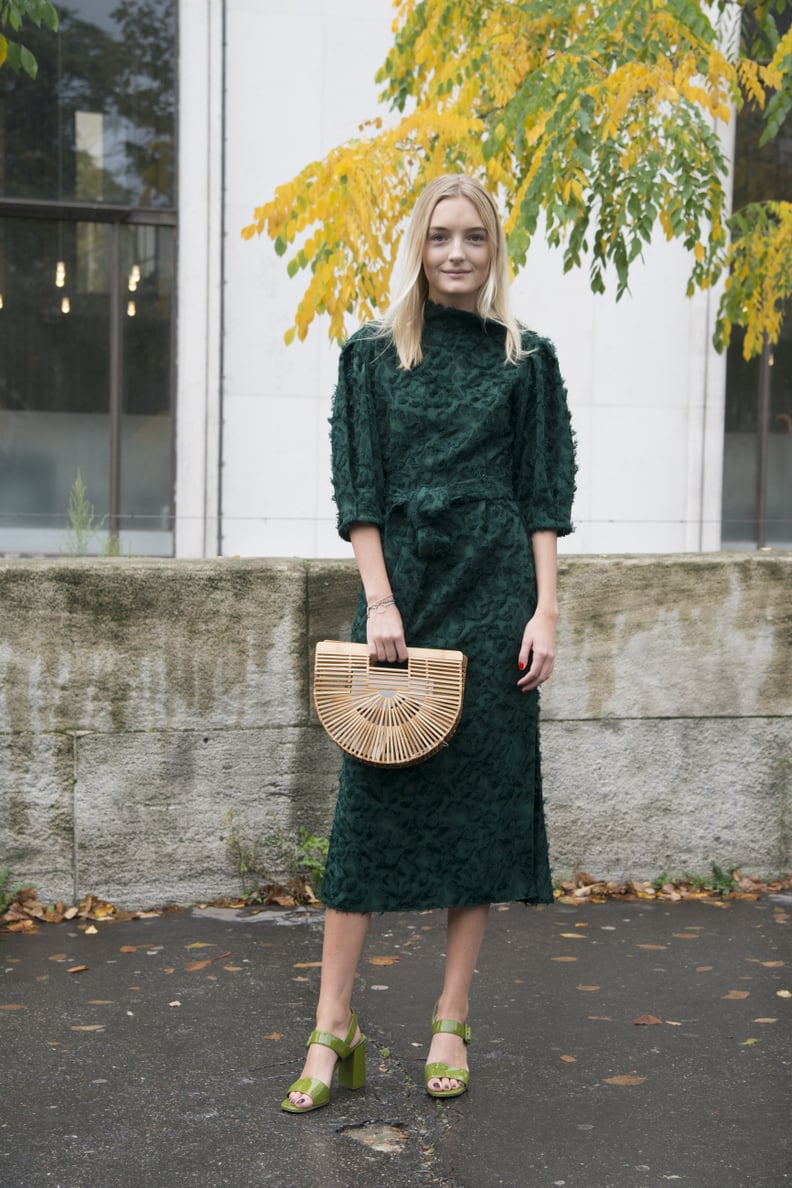 Add a focal point to a textured dress and block heels.