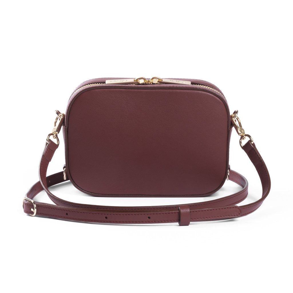 "Small crossbody bags always come in handy, but this cognac camera option from Pop & Suki ($195) — aka Suki Waterhouse's new line — lets you write your name on the bottom. Umm . . . get in my closet!" — SS