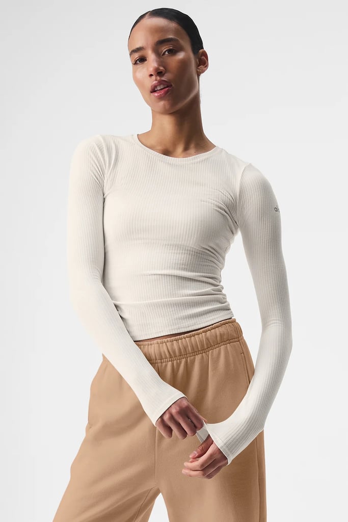Alo Yoga Ribbed Sea Coast Long Sleeve ($74)
Alo Yoga's new Ribbed Sea Coast Long Sleeve is a versatile piece you can dress up or down. Wear it as loungewear, paired with your favorite jeans or a cute skirt, or use it as a base layer for skiing. It's made from a breathable viscose-blend fabric that's soft and stretchy.