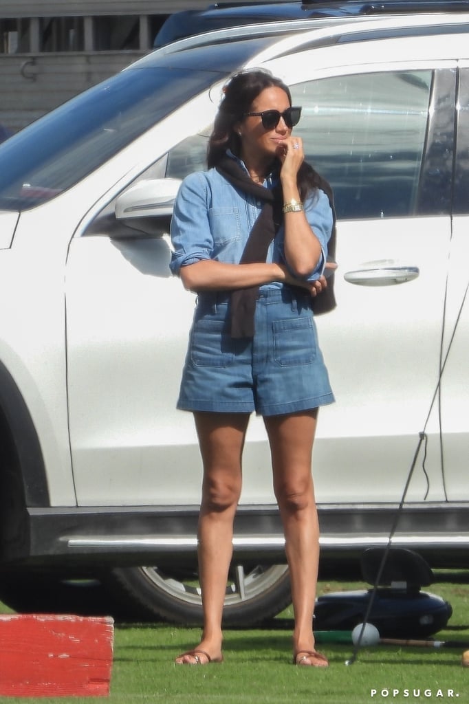 Markle showed off a summer-friendly denim-on-denim moment while watching Prince Harry's polo game at the Santa Barbara Polo & Racquet Club on June 17, 2022. She teamed up a light-wash chambray shirt with darker-wash Dôen shorts with flat sandals from Emme Parsons, a Celine bag, Valentino sunglasses, a Cartier Love bracelet and her Tank watch, as well as a black sweater tied over the shoulders.