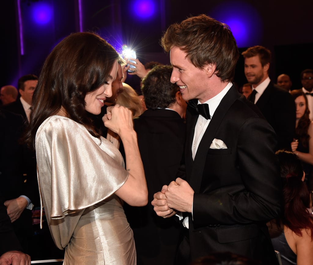 Angelina Jolie shared a laugh with Eddie Redmayne.