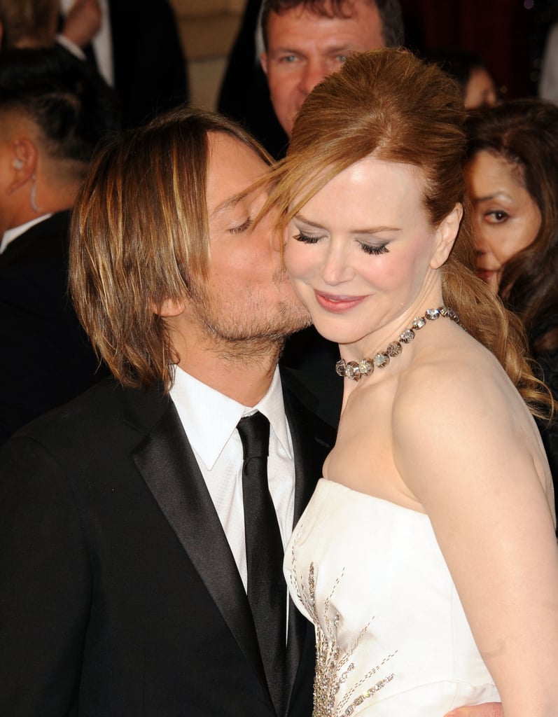 Keith planted a peck on his lady's cheek at the Oscars in February 2011.