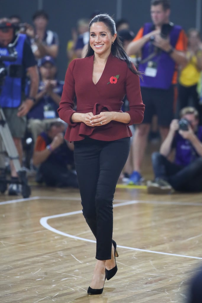 At the Invictus Games in Sydney, Australia, she paired her jeans with a cranberry Theodoure Scanlan jacket and Sarah Flint heels.