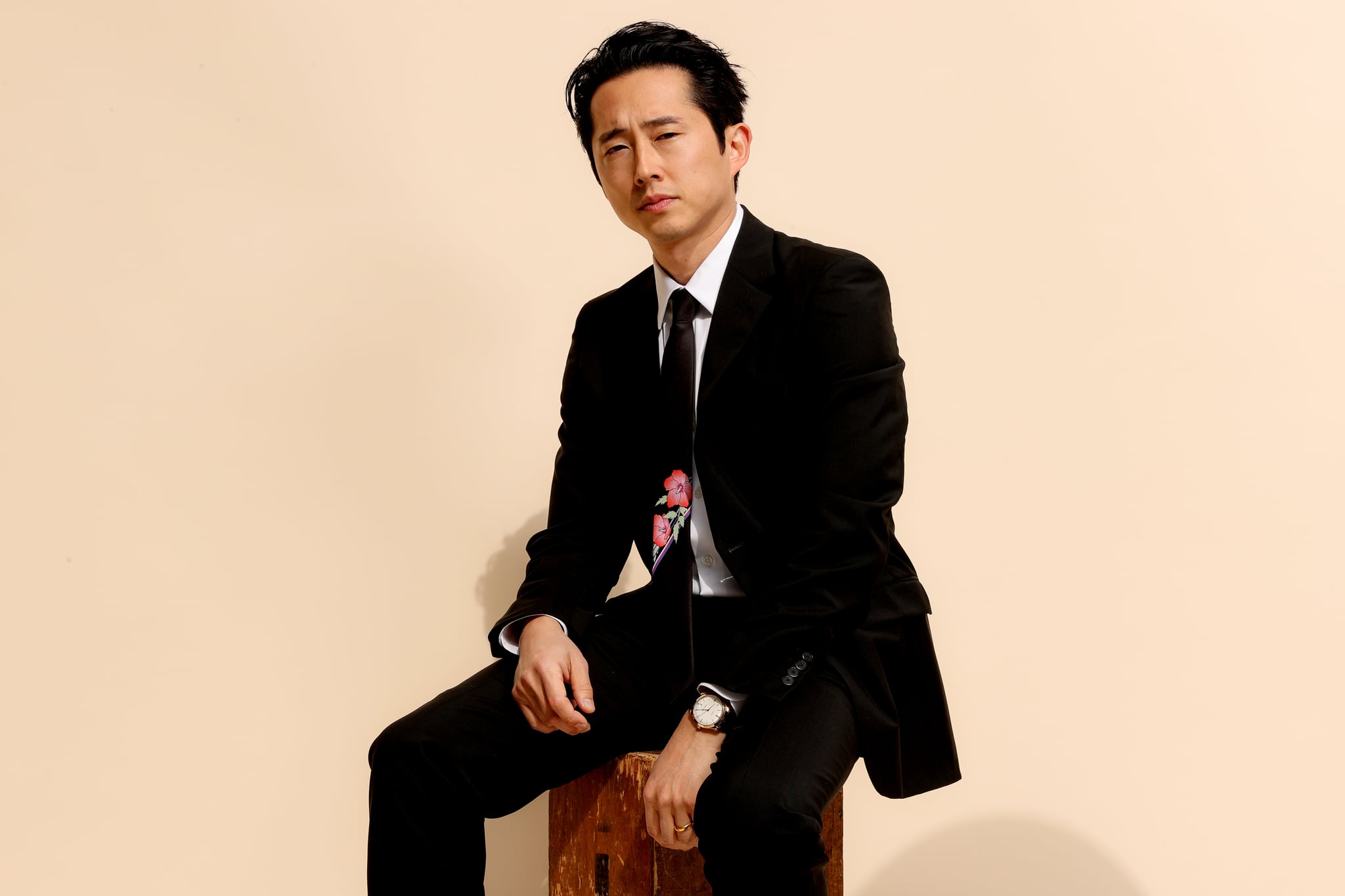 PASADENA, CALIFORNIA - MARCH 07: Steven Yeun, wearing PRADA, gets ready for the 26th annual Critics Choice Awards on March 07, 2021 in Pasadena, California. (Photo by Rich Fury/Getty Images for PRADA)