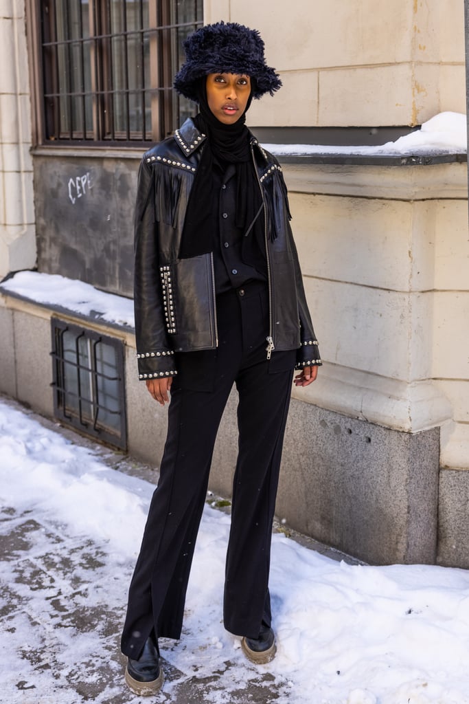 Try contrasting your fuzzy bucket hat with a leather jacket for a fun Western-inspired look.