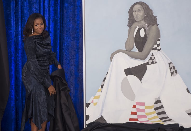 Former US First Lady Michelle Obama unveils her portrait at the Smithsonian's National Portrait Gallery in Washington, DC, February 12, 2018. / AFP PHOTO / SAUL LOEB / RESTRICTED TO EDITORIAL USE - MANDATORY MENTION OF THE ARTIST UPON PUBLICATION - TO ILL