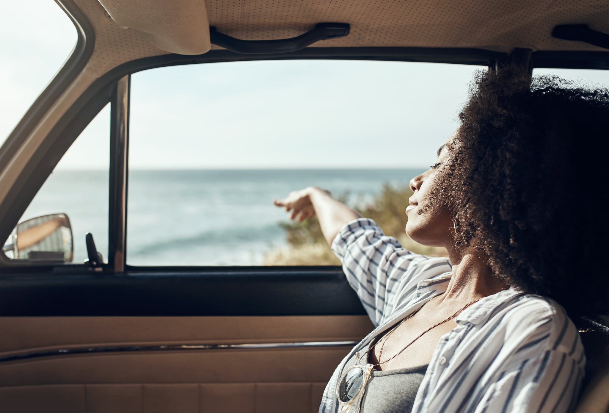 Young woman enjoying a relaxing road trip Mercury in Gemini