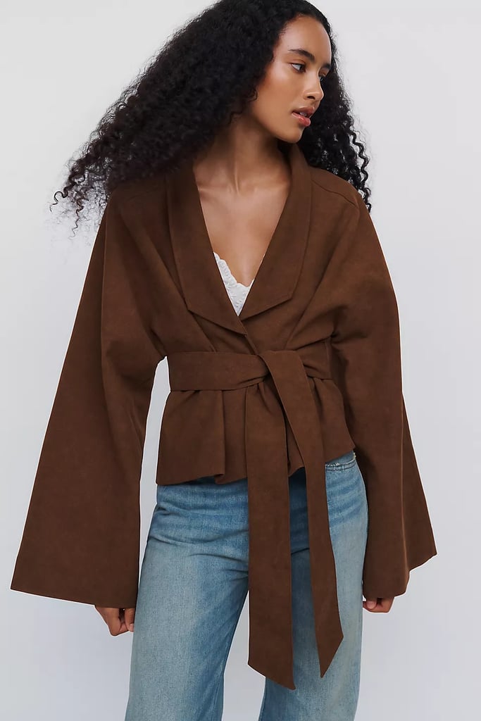 Anthropologie Siempre Faux-Suede Dolman Jacket ($158)
Consider this jacket proof that even heavier fabrics can look effortless. This faux-suede jacket looks flowy and fresh no matter how you style it. From the oversize sleeves to the tie belt waist, this outerwear will naturally drape your curves for a flattering fit.