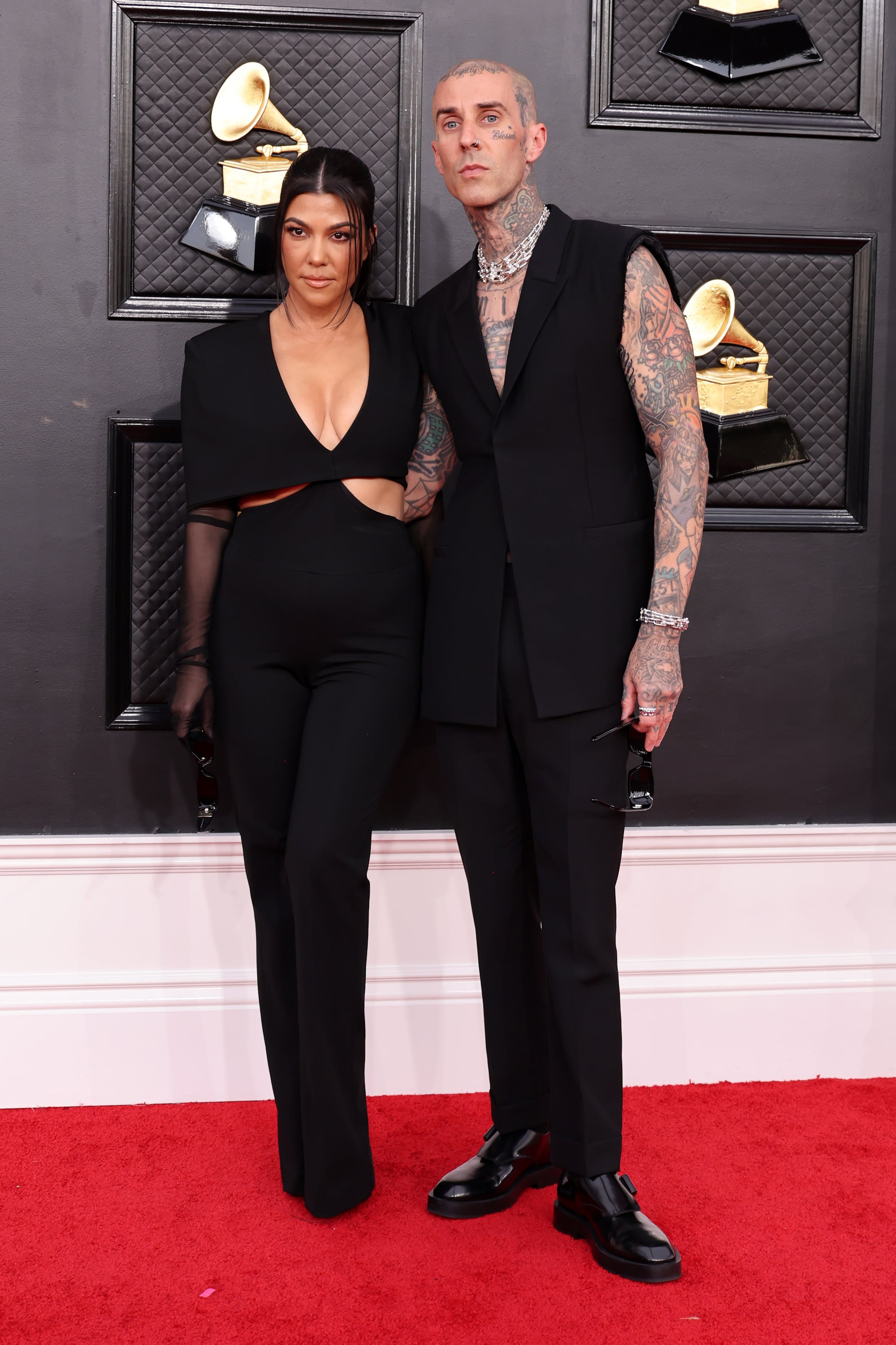 LAS VEGAS, NEVADA - APRIL 03: (L-R) Kourtney Kardashian and Travis Barker attend the 64th Annual GRAMMY Awards at MGM Grand Garden Arena on April 03, 2022 in Las Vegas, Nevada. (Photo by Amy Sussman/Getty Images)