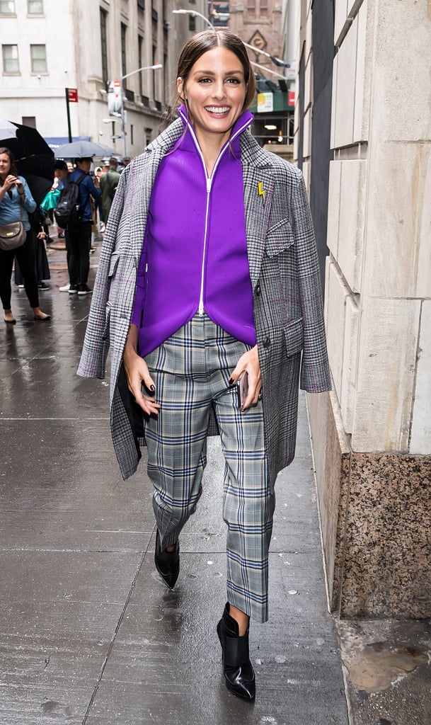 Olivia remixed a plaid Tibi suit with a sporty and bright Tibi zip-up while heading to the show in NYC.