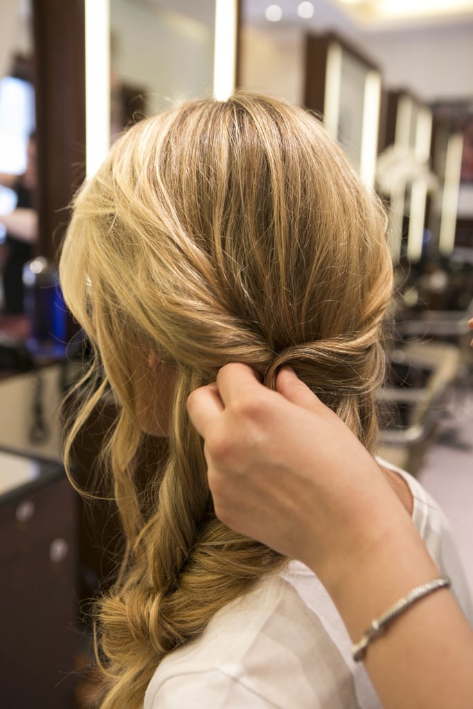 To complete the look, pull a section of hair to match the twisted-back part behind your ear. This section should come from the same side you started your braid on, directly above the braid.