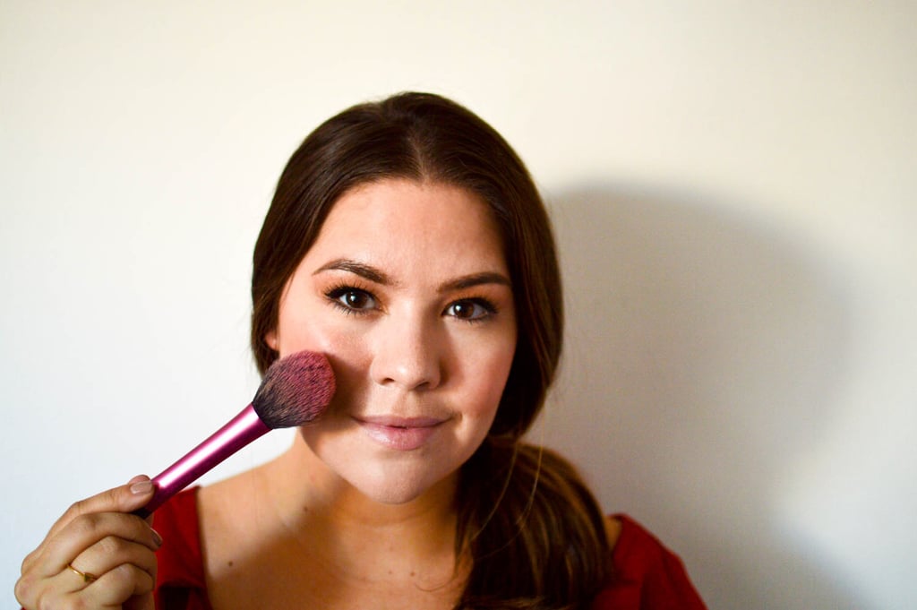 Elena's cheeks are a soft coral color and are fairly bright. To mimic this, use a pigmented blush, like MAC Powder Blush in Pinch o' Peach ($23).