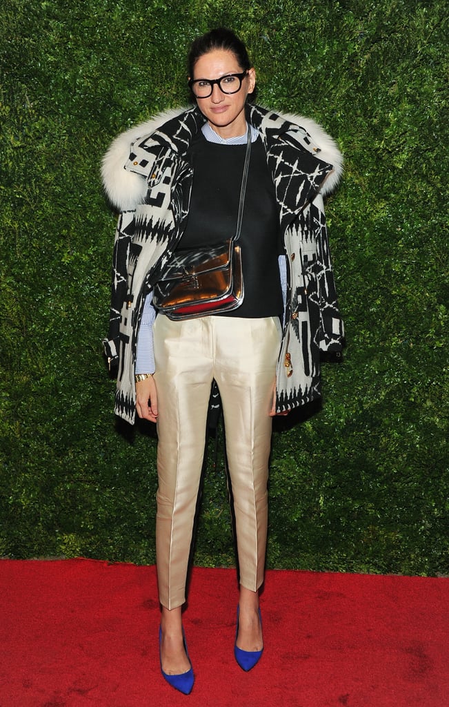 For a movie screening, Lyons paired all kinds of statement pieces together and made it work. Gold pants plus cobalt heels and a fur-trimmed parka? Yes!