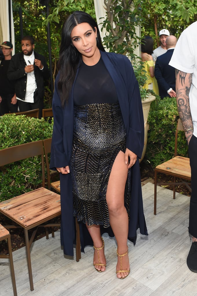Kim drew all eyes in the front row, wearing a	 seriously sexy Altuzarra skirt.