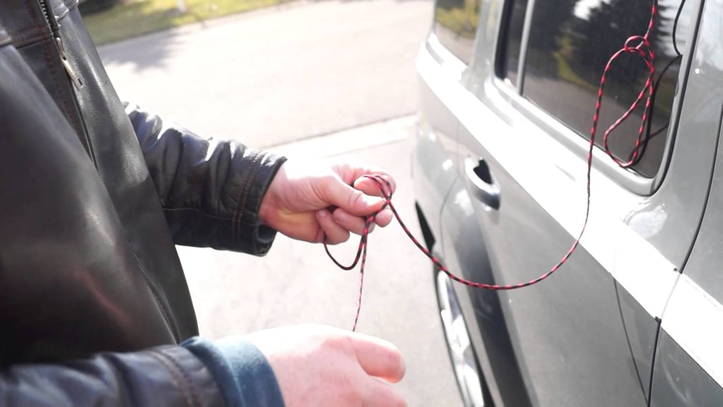 Unlock a car door with shoelaces.