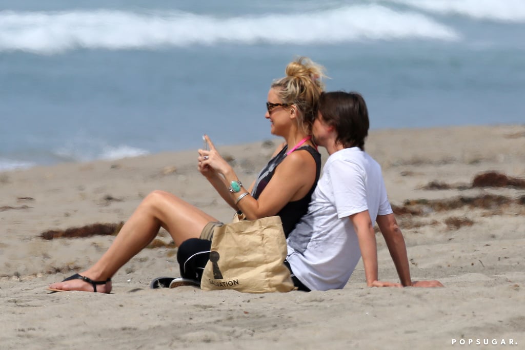 Kate Hudson and Matthew Bellamy shared kisses and cuddles on a Malibu beach in March 2014.