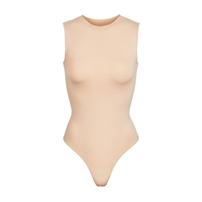 SKIMS Sleeveless Crew Neck Thong Bodysuit in Sandstone