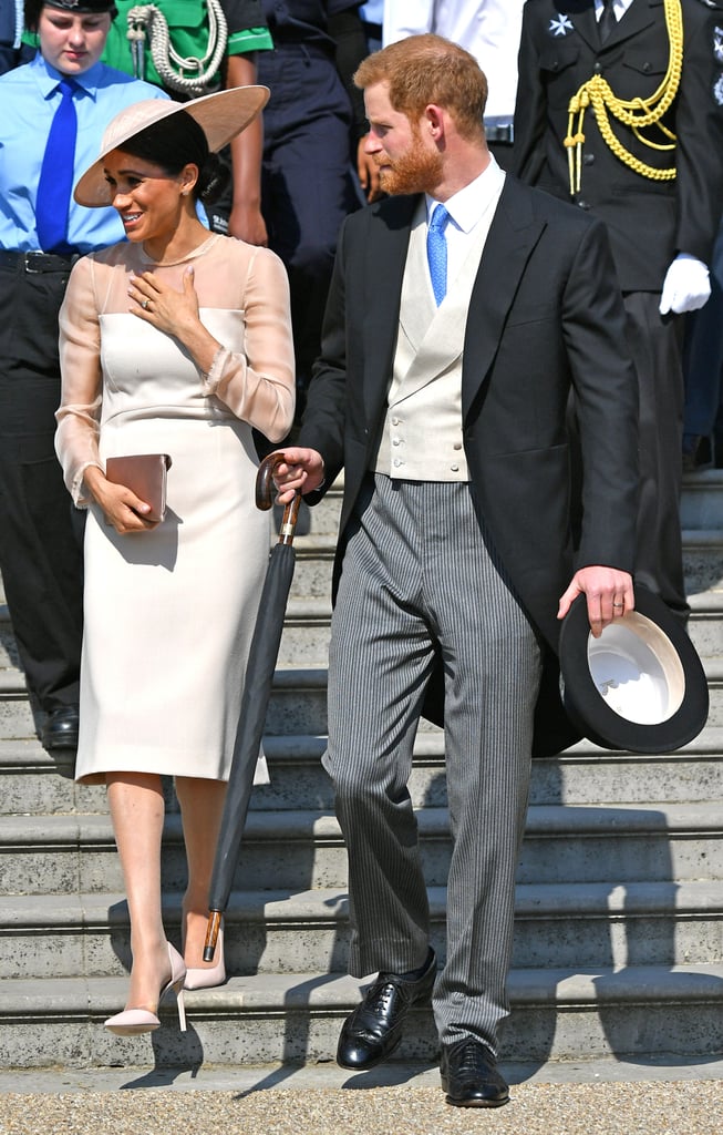 After tying the knot with Prince Harry, Meghan stepped out for her first official event as Duchess in this peach Goat Fashion dress. Meghan celebrated Prince Charles's 70th birthday in the look, which was finished with eyecatching Tamara Mellon heels.