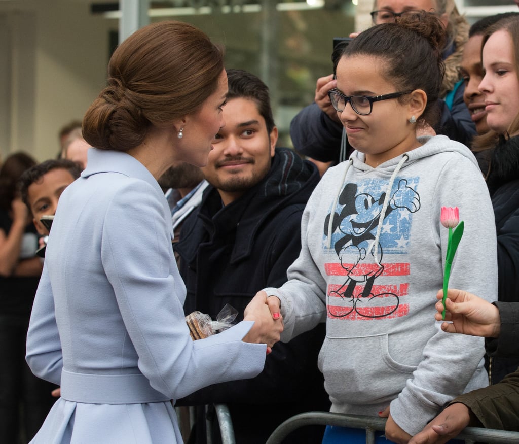 During her first solo tour in October 2016, Kate shook hands with a young girl in the Netherlands.