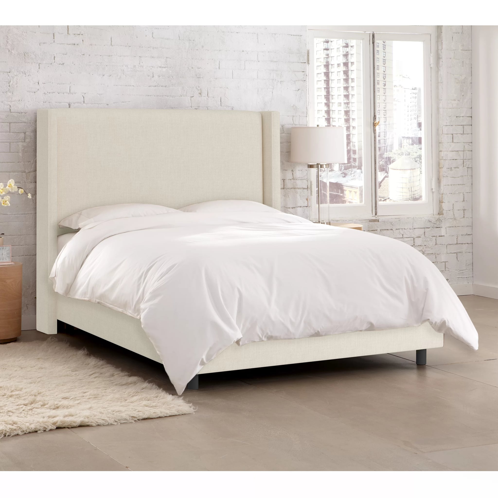 Upholstered low store profile bed frame