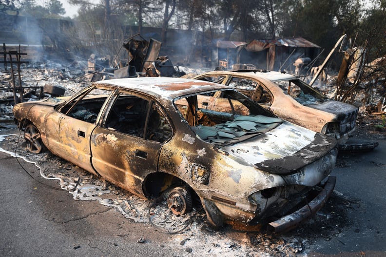 Burned cars sit empty after being claimed by a wildfire.