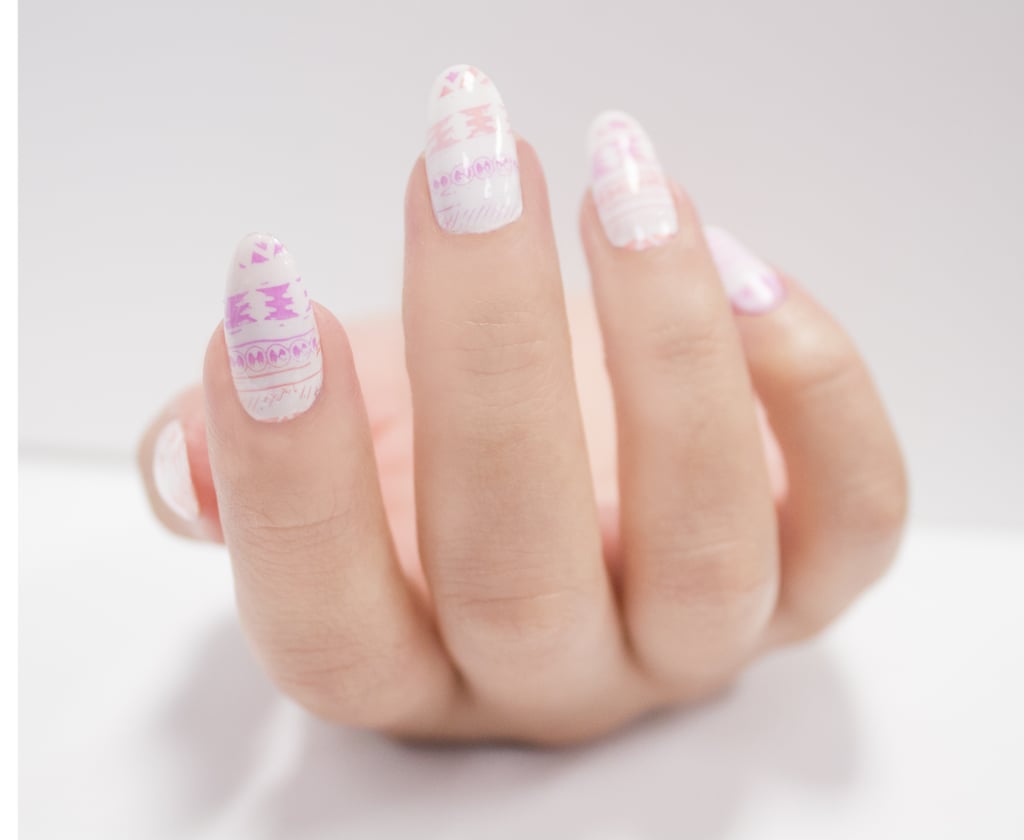 For the middle section, use a fine art brush and dot in the chevron pattern as a guide. Next, connect the dots in a fluid motion with the same brush. Continue to stack the chevron pattern until you meet the next border of striping tape. Remove all striping tape. 
Use a bobby pin or dotting tool to make marks across the nail in a single row, creating a dotted line between each section.