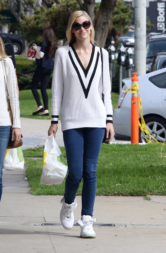 Jaime King's preppy-cool outfit is centered around her sporty Rag & Bone sweater.