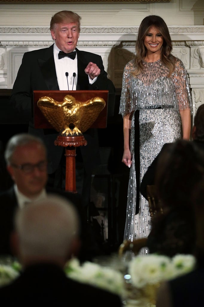 Melania wore a Monique Lhuillier silver gown on stage while Donald Trump gave a speech in September 2017.