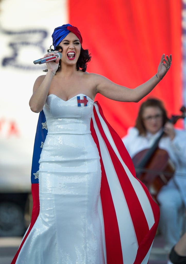 Katy performed at the Iowa rally, showing off her strapless sequined dress and American flag cape and head wrap.