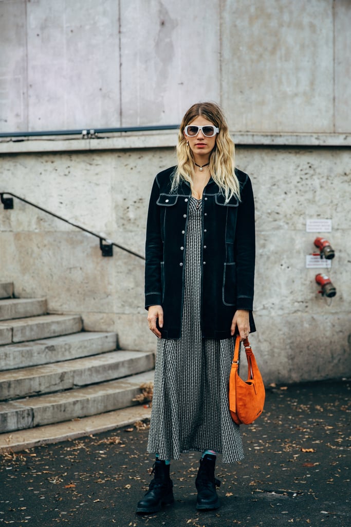 Carry a neon bag with a midi dress.