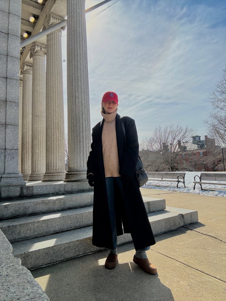 "This outfit is nostalgic to me in the best way. Clogs were such a big part of my middle school wardrobe, so wearing them now just makes me smile a little. It feels like I'm revisiting that version of myself, just styled in a way that fits my life now. I threw them on with an oversize sweater, long coat, and my go-to baseball cap — nothing complicated, just pieces I always feel good in. I like that the UGG Otzo Clogs ($150) make the outfit feel relaxed and a little lived-in instead of too put together. They're the perfect winter-to-spring staple, and they definitely passed the walking test." — Haley Lyndes, shopping staff writer