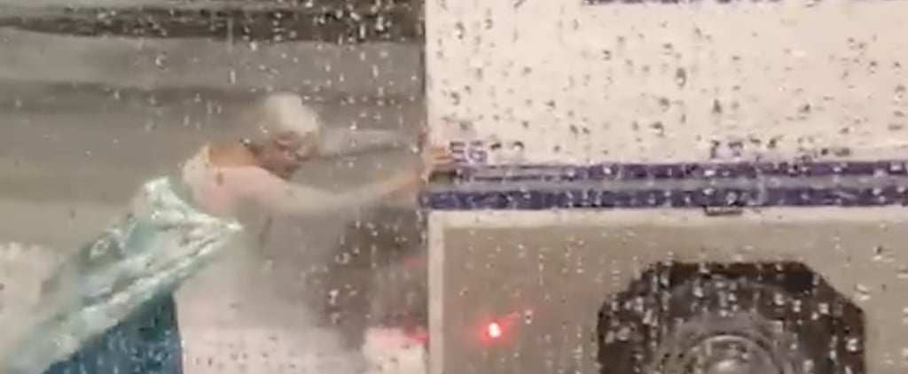 Man Dressed as Elsa Pushing a Van Out of a Snowbank