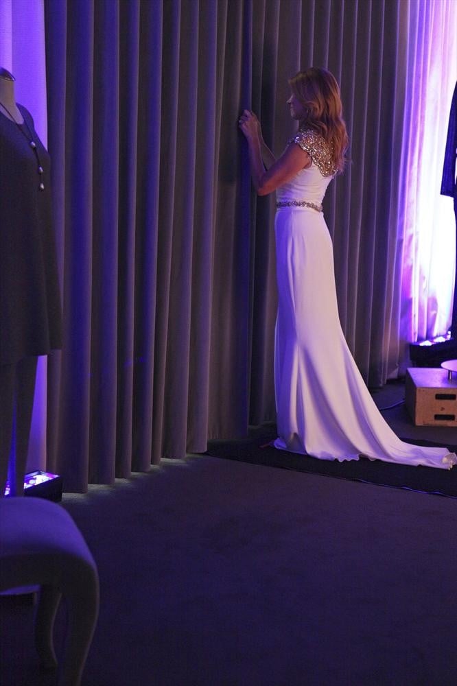 We get a shot of the back of the dramatic gown.